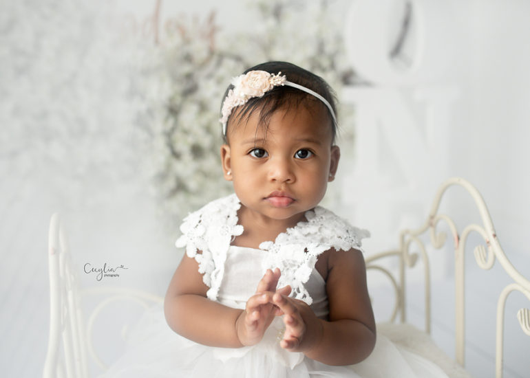 a baby girl looking at cecylia photography camera