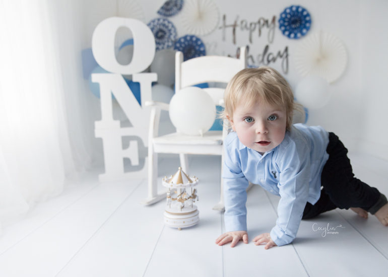 one years old boy smiling on photo session