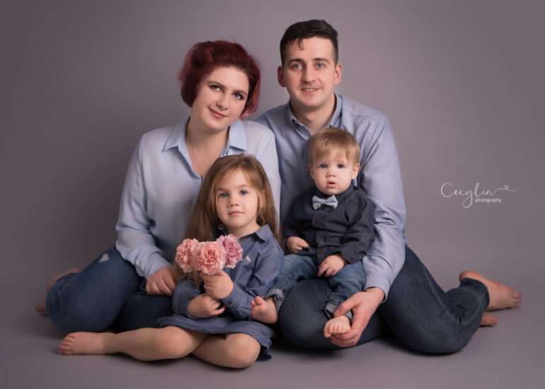 family of four having a photo session in photography studio