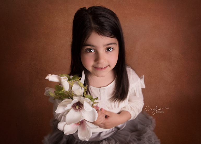 a kid smiling to the camera