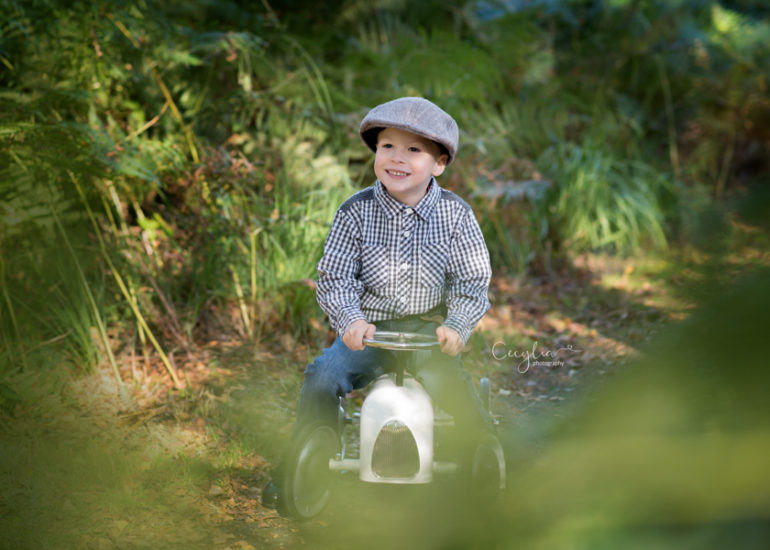 a boy sitting on the white car in the park pictured by cecylia photography