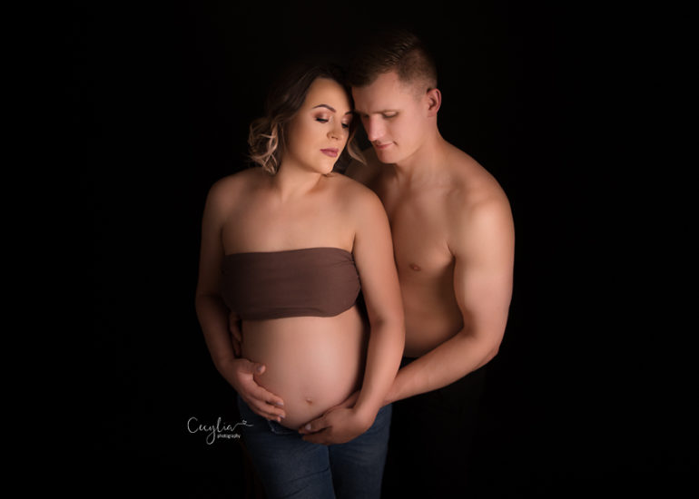 pregnant women with a partner having a maternity photo session