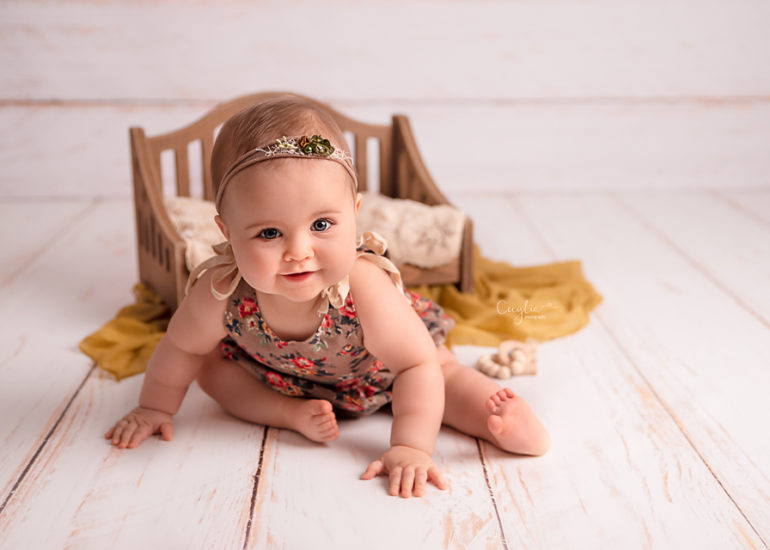 happy baby on the sitters photo session