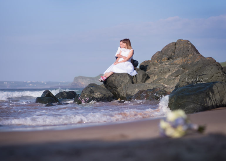a couple lookind at the sea wedding photography